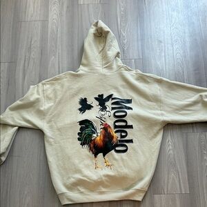 ModelCo Beige Hoodie with Rooster Graphic